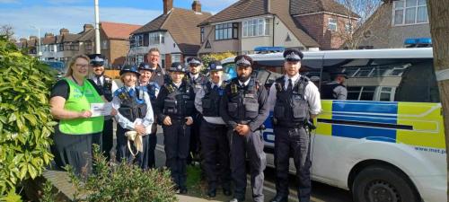 Cllr Jane Keane with local police for a door to door exercise to prevent theft from motor vehicles.